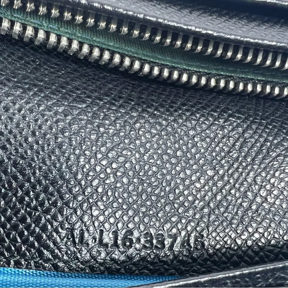 1050: Bvlgari Logo Ring Continental Wallet Black Grained Leather Blue